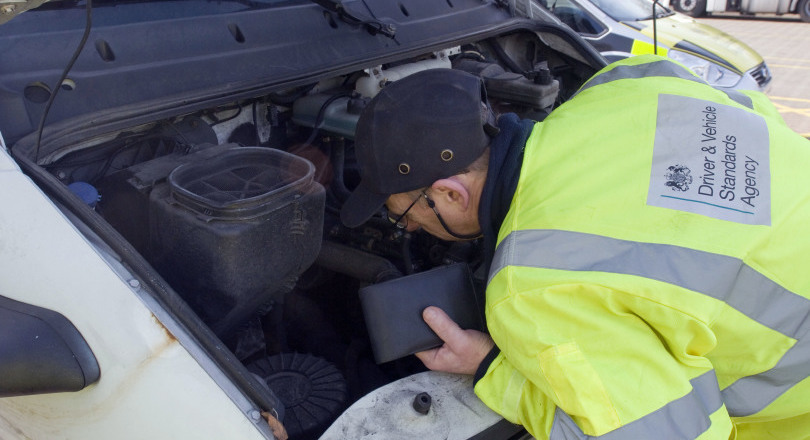 DVSA officer inspects vehicle