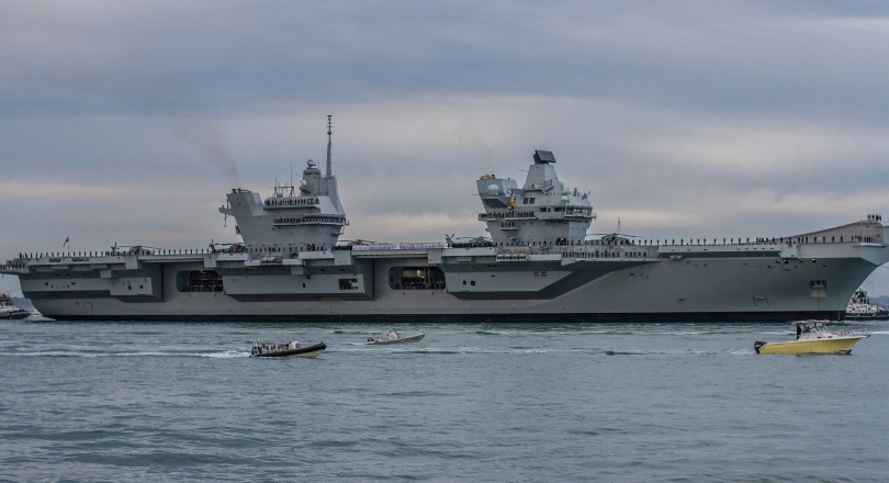 Side view of HMS Queen Elizabeth with crew on deck